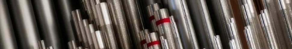 A rank of organ pipes located at the front of the sanctuary